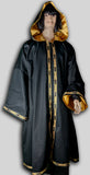 Robe made from black cotton twill fully lined in gold satin with trim 202 around opening, hem and sleeves. Made in USA.